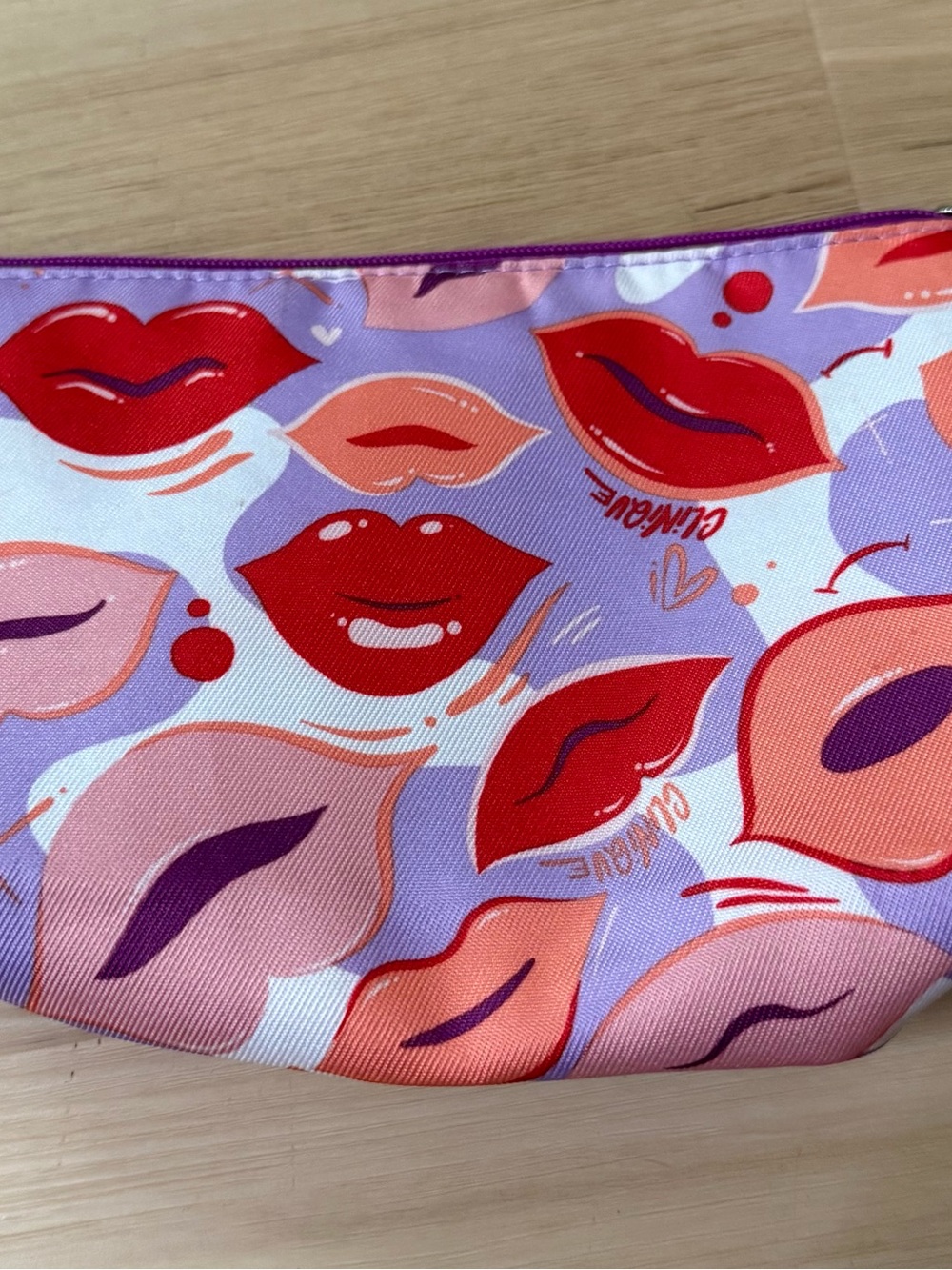 Clinique Purple Lip-Print Cosmetic Pouch with Red & Pink Accents. 9”X6”